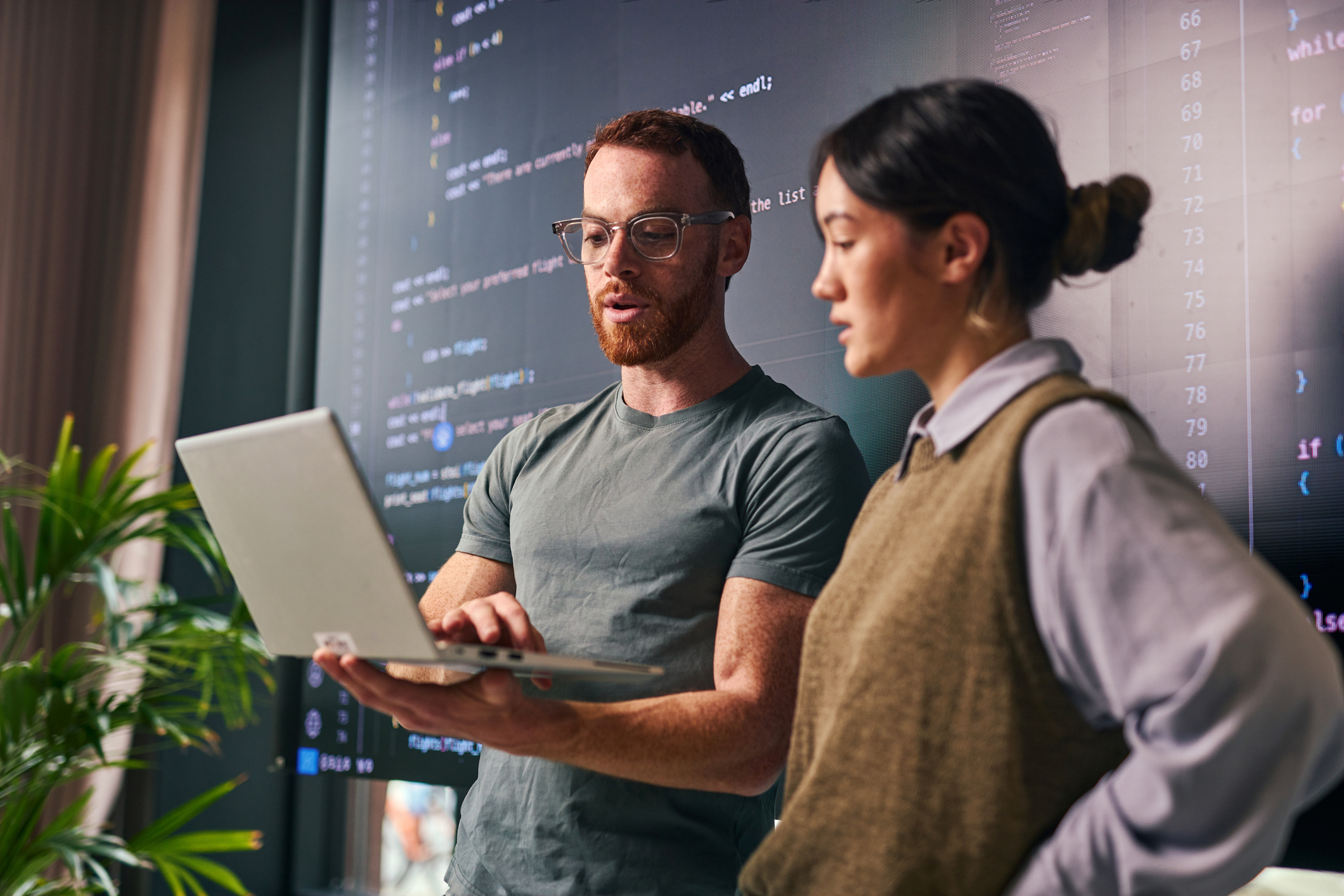 Developers collaborating at a desk